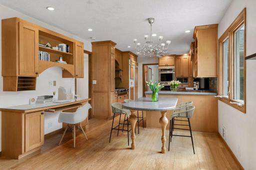 This built-in dining peninsula easily accommodates 4-6 chairs. Virtually Staged