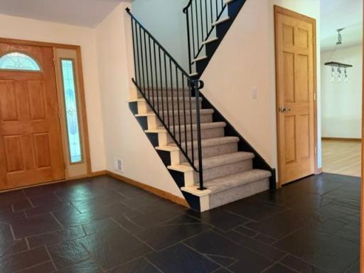 Check out the beautiful slate floor foyer....easily maintained and perfect for our mid-west seasons!