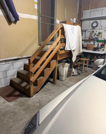 Inside garage stairs to enter the property.jpg