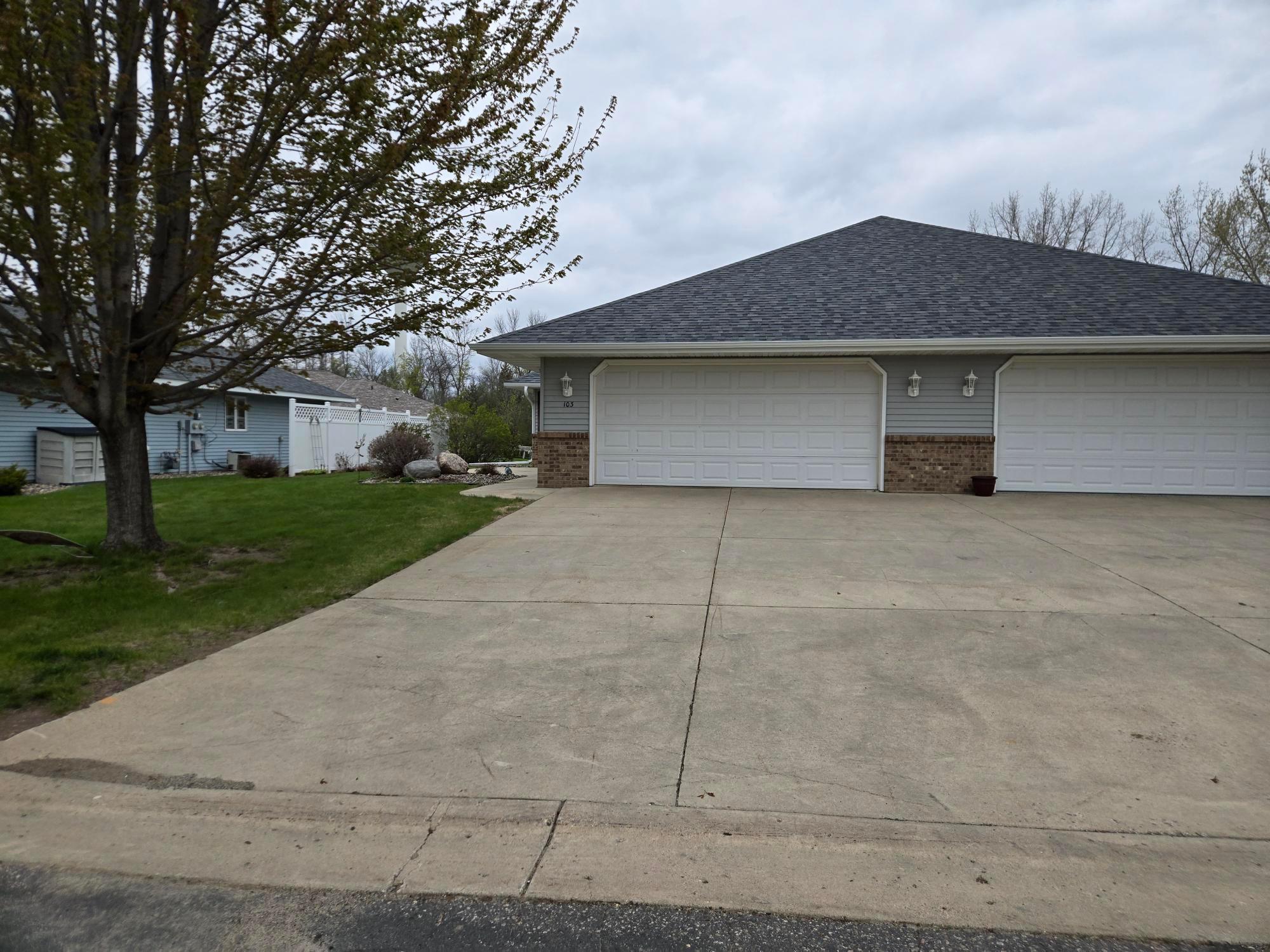 Spacious 2 car garage w/wide cement driveway
