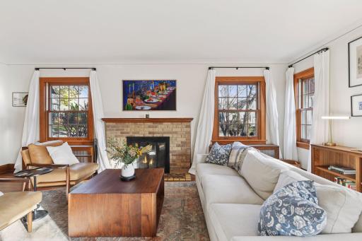 Functioning wood burning fireplace anchors the living room.