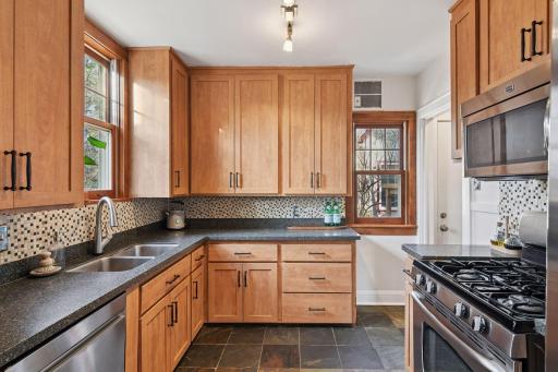 Gas stove and stainless appliances highlight the kitchen.