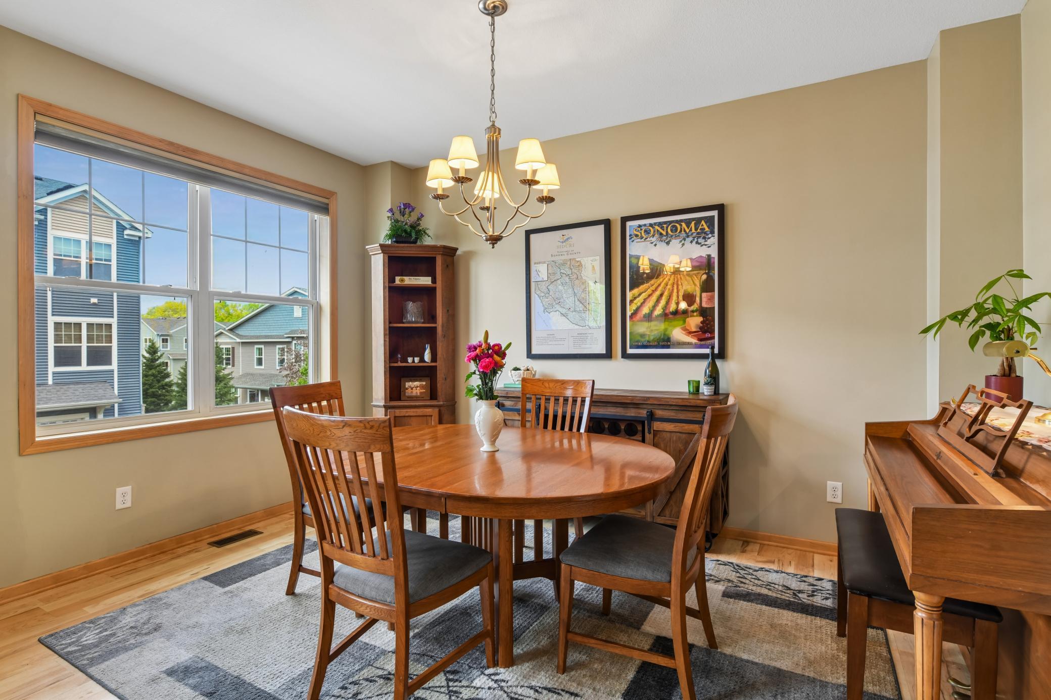 Good-sized dining area provides plenty of room for large table, chairs, hutch and even a piano!