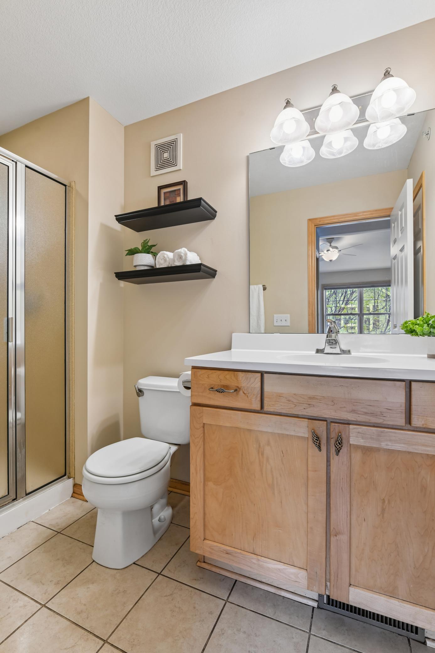 Owner's bath features new vanity top (2026) and handy linen closet for storage
