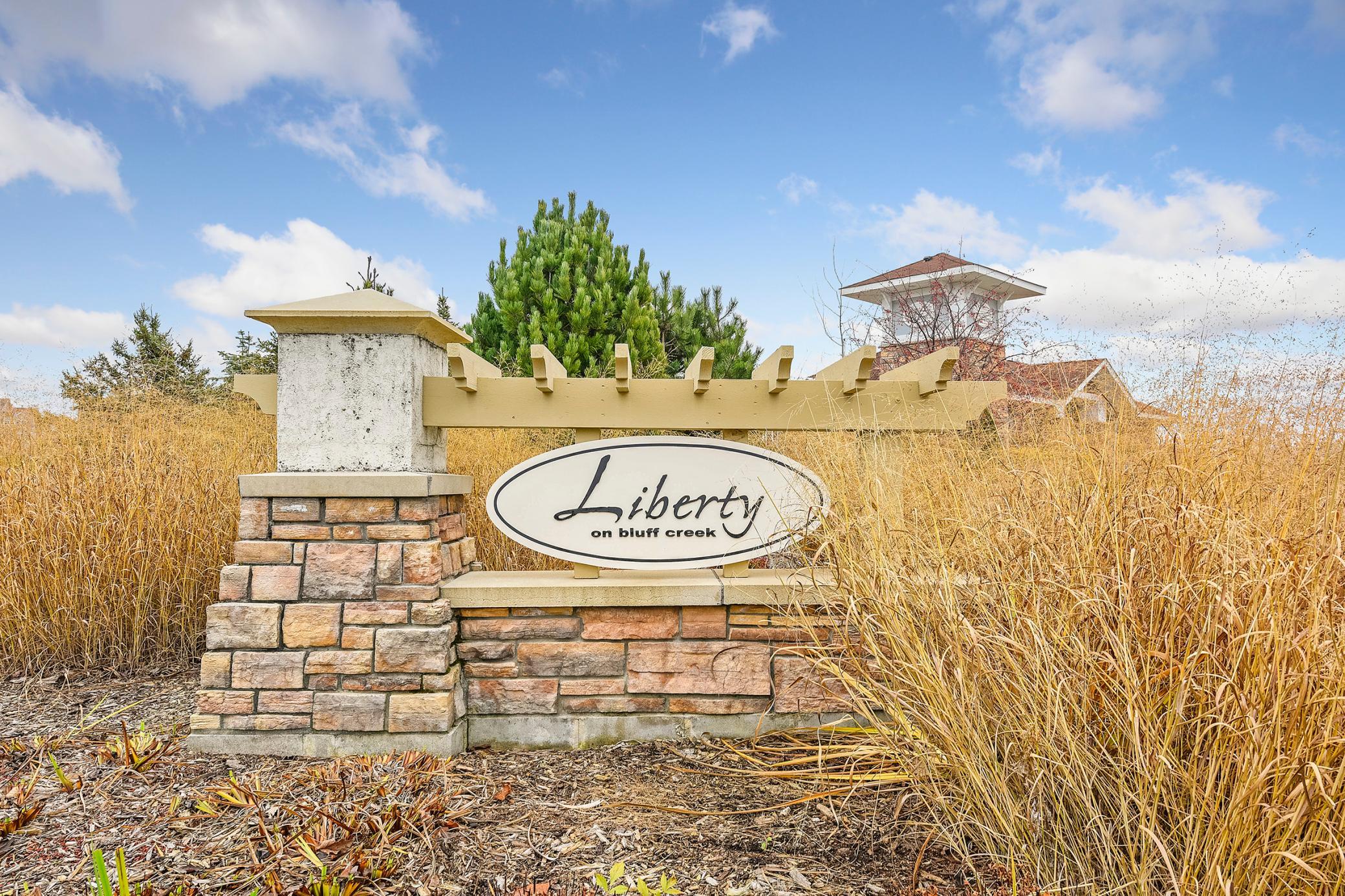 Located in the desirable Liberty on Bluff Creek with beautiful amenities including pool, park, trails, and mature trees throughout!