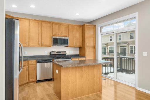 Maintenance-free deck conveniently located off the kitchen—ideal for grilling, morning coffee, or enjoying the outdoors.