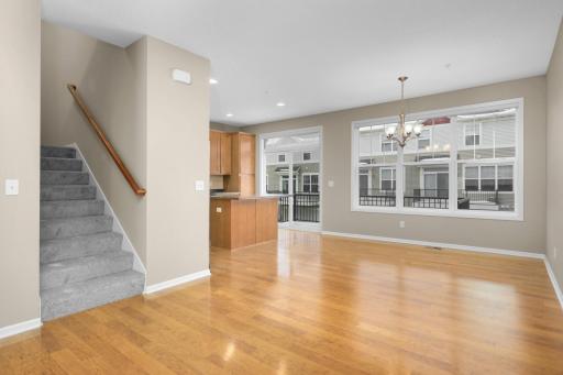 Comfortable and versatile family room located just off the dining area, offering a great secondary living space for everyday use, media, or play.