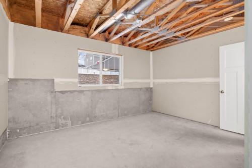 Unfinished lower level perfect for a workout room.