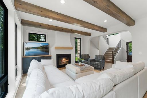 Custom fireplace to match the kitchen hood. Room for a 70" TV.