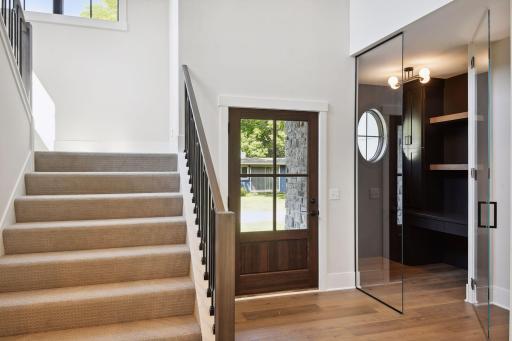Glass front door allows direct views to the lake from entry.