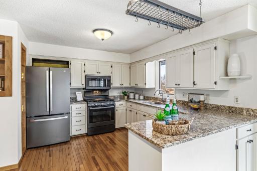Kitchen features newer stainless steel appliances.