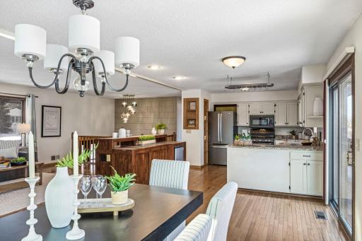 Patio doors off the dining area lead to a large deck, perfect for outdoor meals.