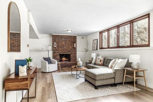 Lower level family room is spacious and bright with new vinyl flooring.