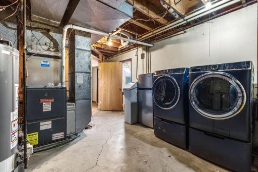 Utility room has lots of storage. New washer & dryer in 2024.