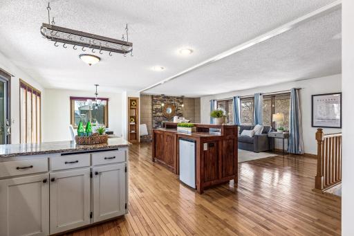 Additional beverage refrigerator is built-in to buffet.