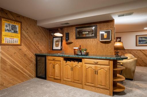 Friends and family will enjoy game nights and beverages served at the wet bar.