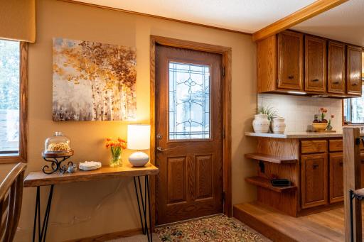 Grilling and dining outdoors is easy to access from the kitchen with the side door on the West side of the kitchen/dining room.