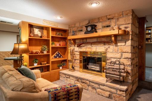 This beautiful wood burning fireplace adds so much character to this level.