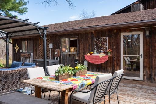 Designed for both relaxation and entertaining, the home features multiple outdoor living spaces for outdoor dining...