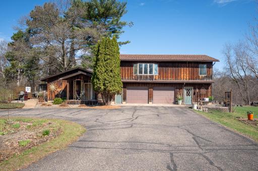The home's naturally weathered cedar exterior showcases a striking multi-toned patina, appreciated for its effortless beauty and low maintenance. The "living" finish creates a timeless, earthy warmth, allowing the home to blend with the landscape.