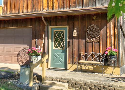 The third garage stall has a service door on the front of the house and an overhead door on the back of the house.