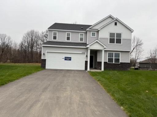 Welcome to the Mitchell!! High-quality modern materials, including vinyl siding, stone accents, and contrasting trims combine to create a sophisticated and durable exterior.