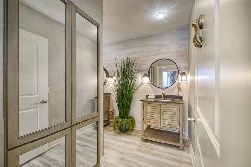 Well-appointed bath with abundant built-in storage.