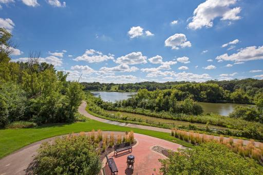 Professionally manicured back yard lounge areas, trails, and lake-designed to draw you outside to enjoy this lakeside park.