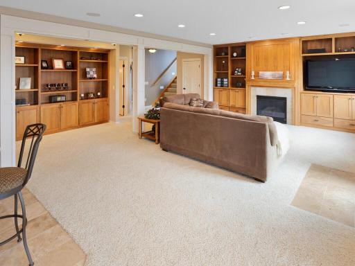 Another angle of the family room showcasing the wonderful built-in bookcases in the lower hall.
