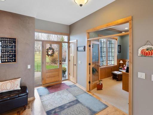 Open and bright foyer features full glass entrance that looks into the heart of this stunning home.