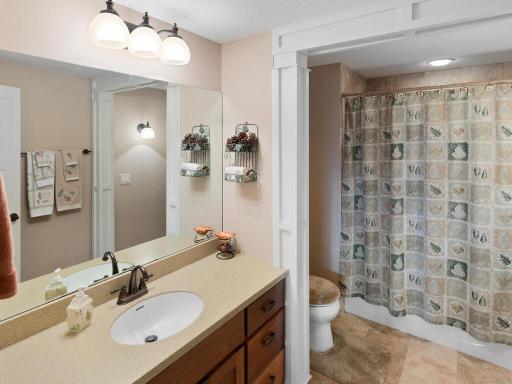 Lower level bath features tile floors and tub/shower surround.