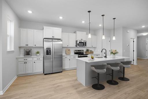Beautifully finished kitchen with quartz countertops and stainless steel appliances!