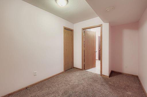 26 Second view of the flex space with walk through to bathroom.
