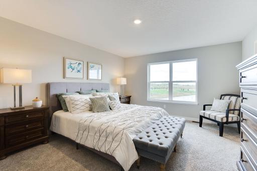 A great place to escape to and call your own. Here you see your very own large primary suite. Similar model home. Options and colors may vary.