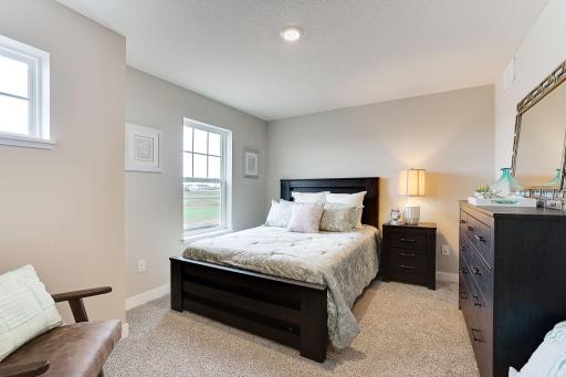 Spacious bedrooms upstairs. Similar model home. Options and colors may vary.