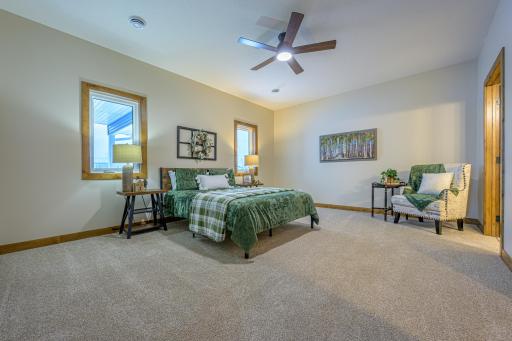 The spacious primary bedroom features a private ensuite bathroom and a walk-in closet.