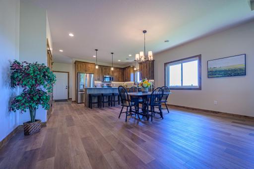 LVT flooring is featured throughout the open concept main living areas.