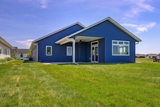 The covered back patio offers seamless indoor-outdoor living.