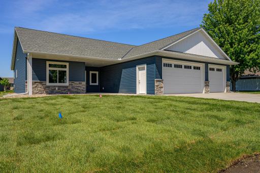 The three car attached garage features 8-foot tall overhead doors.