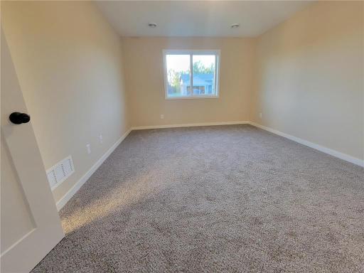 Alt Primary Bedroom (*not exact home pictured. Photos depict similar home following the Princeton B plan).