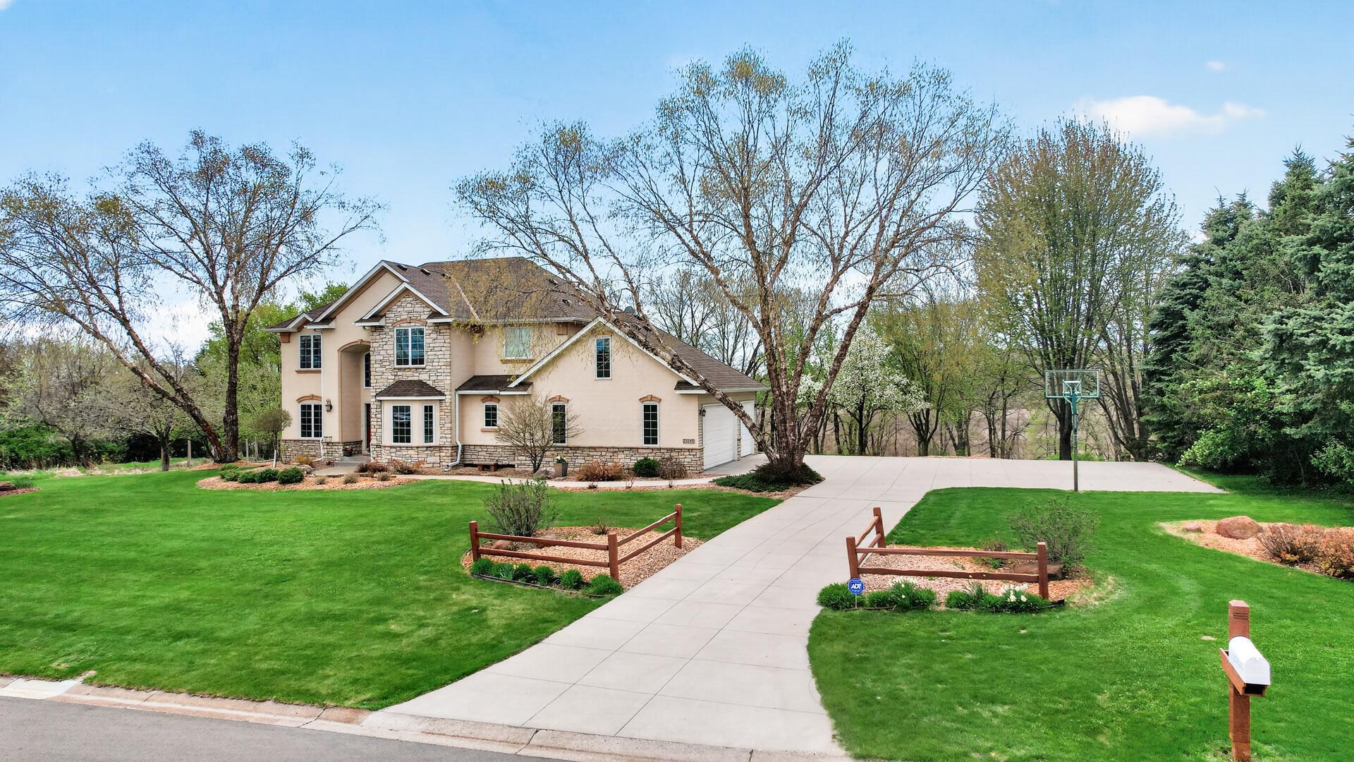 Concrete driveway with guest parking and a basketball hoop!
