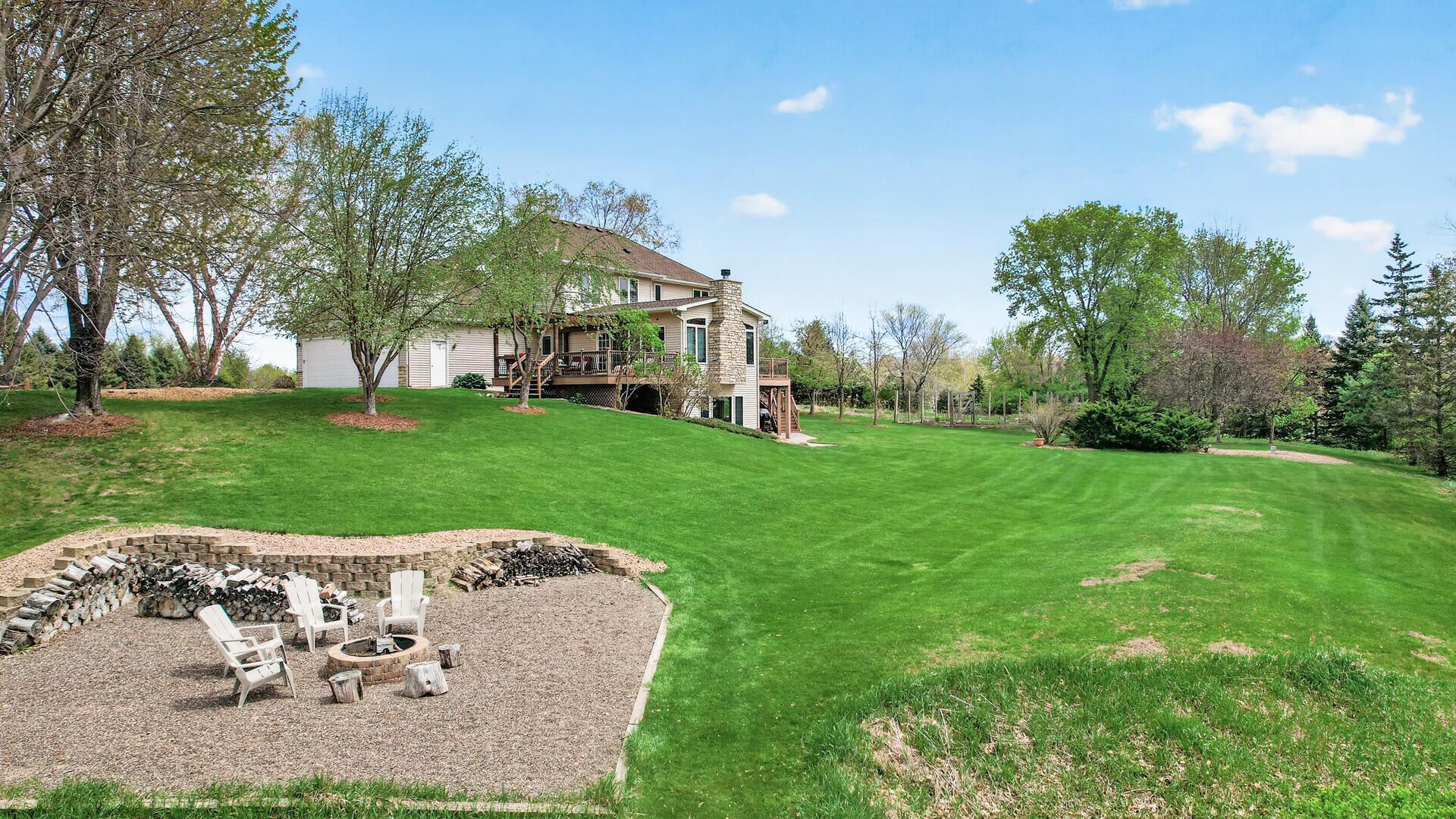 Expansive back yard with firepit