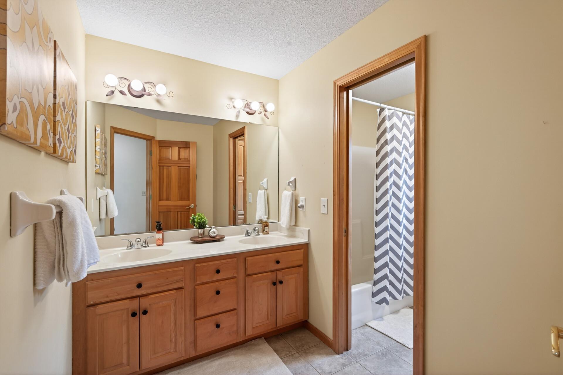 Split bathroom layout in the upper level
