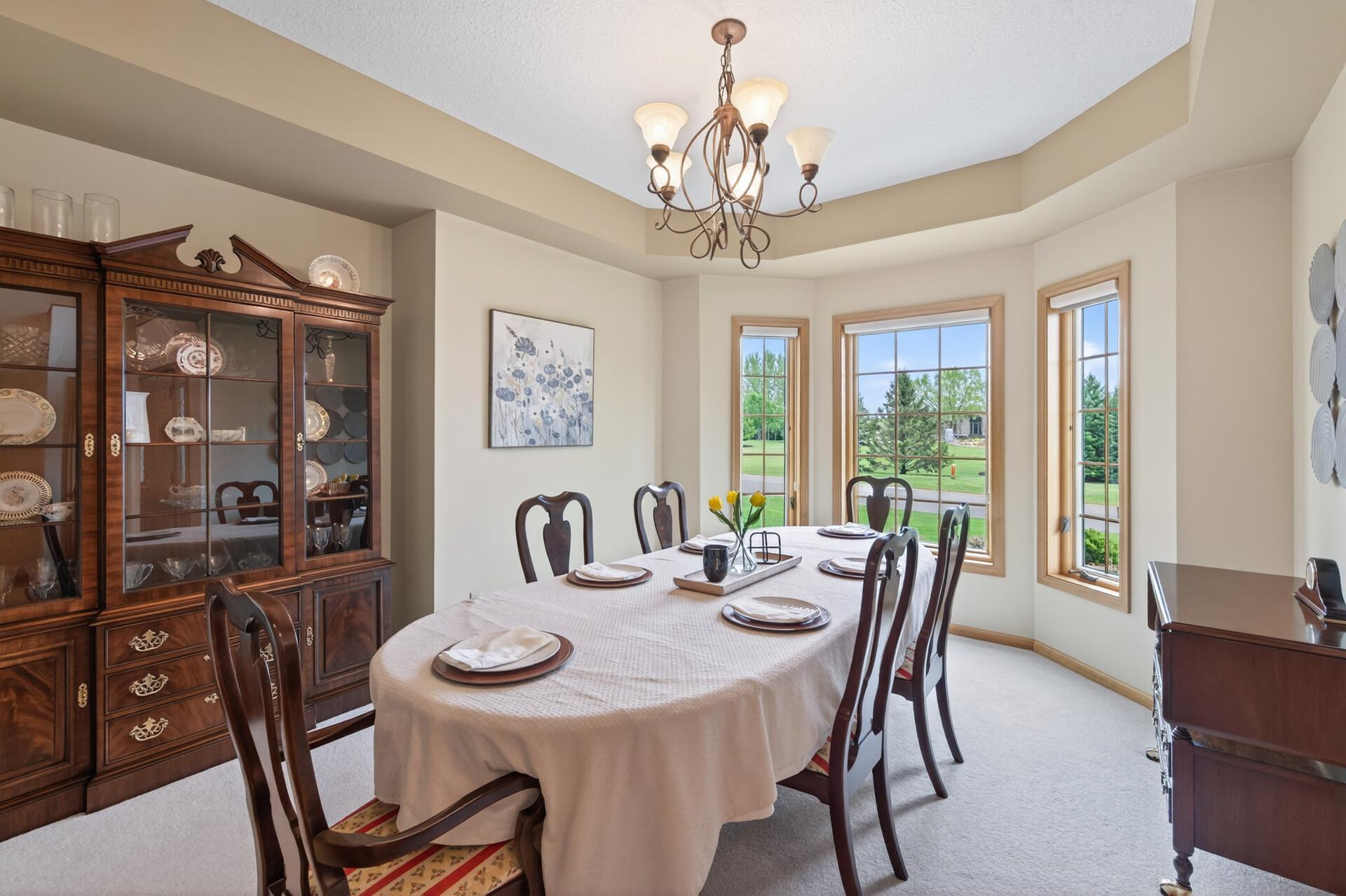 Formal dining room with windows facing streetside
