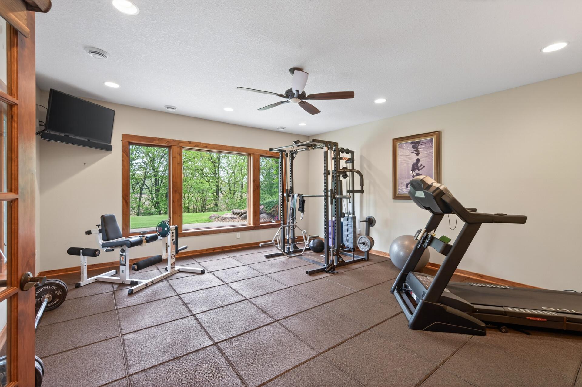 Gym space with views of the backyard (and heated floors)