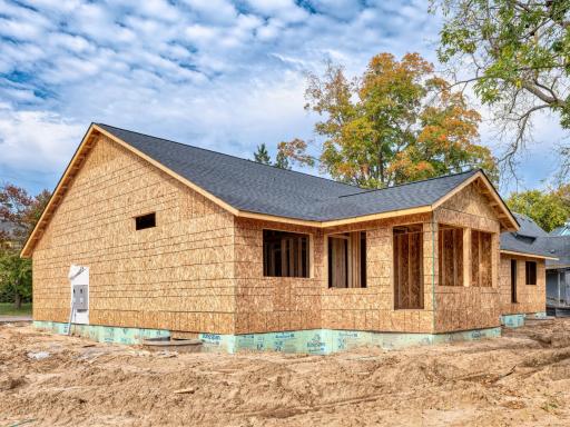 This side features a bit more square footage and a sunporch with hand door providing access to the backyard green space.