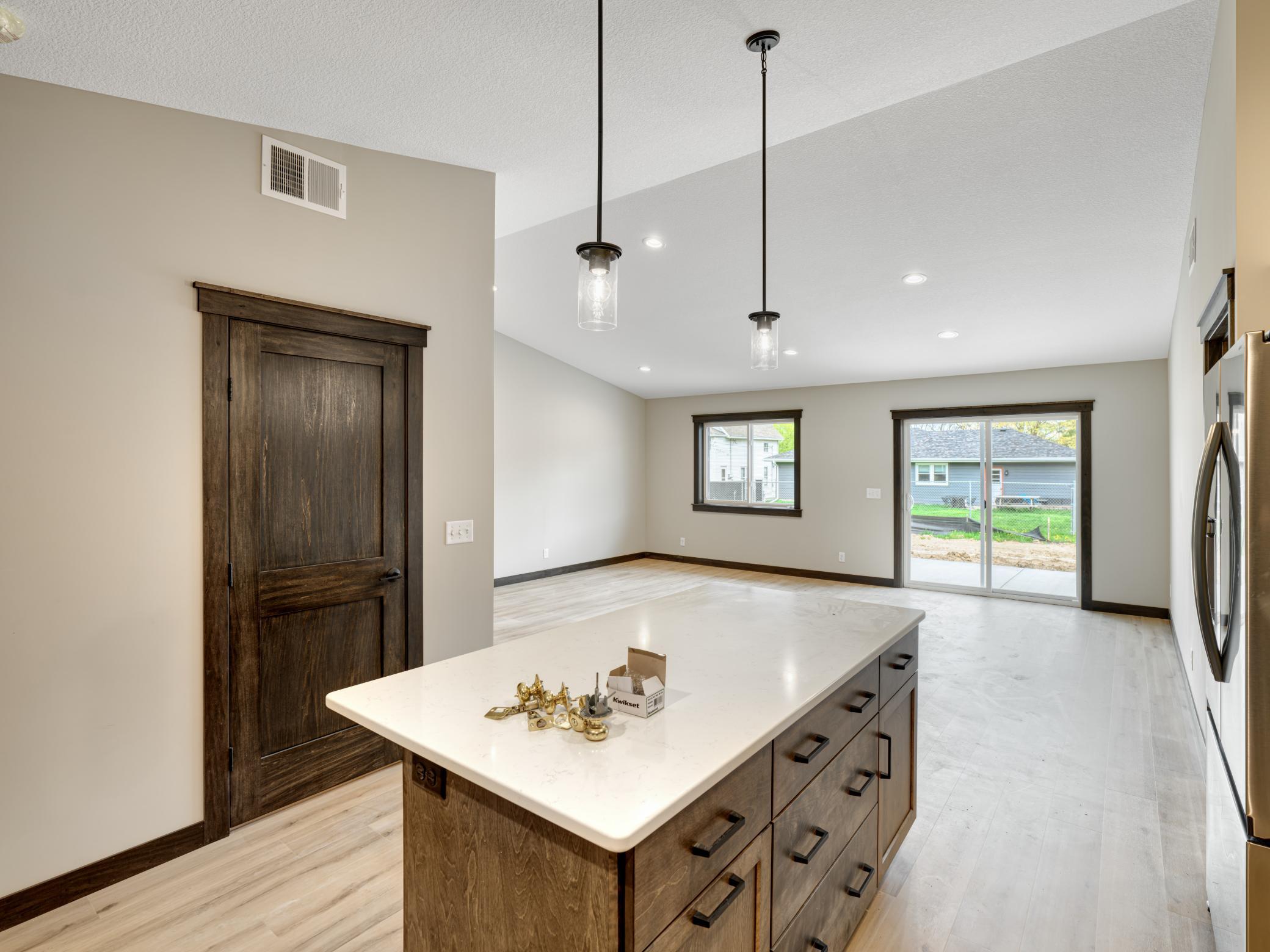 8 - 234 Kitchen - Kitchen island features handy seating space as well as extra storage