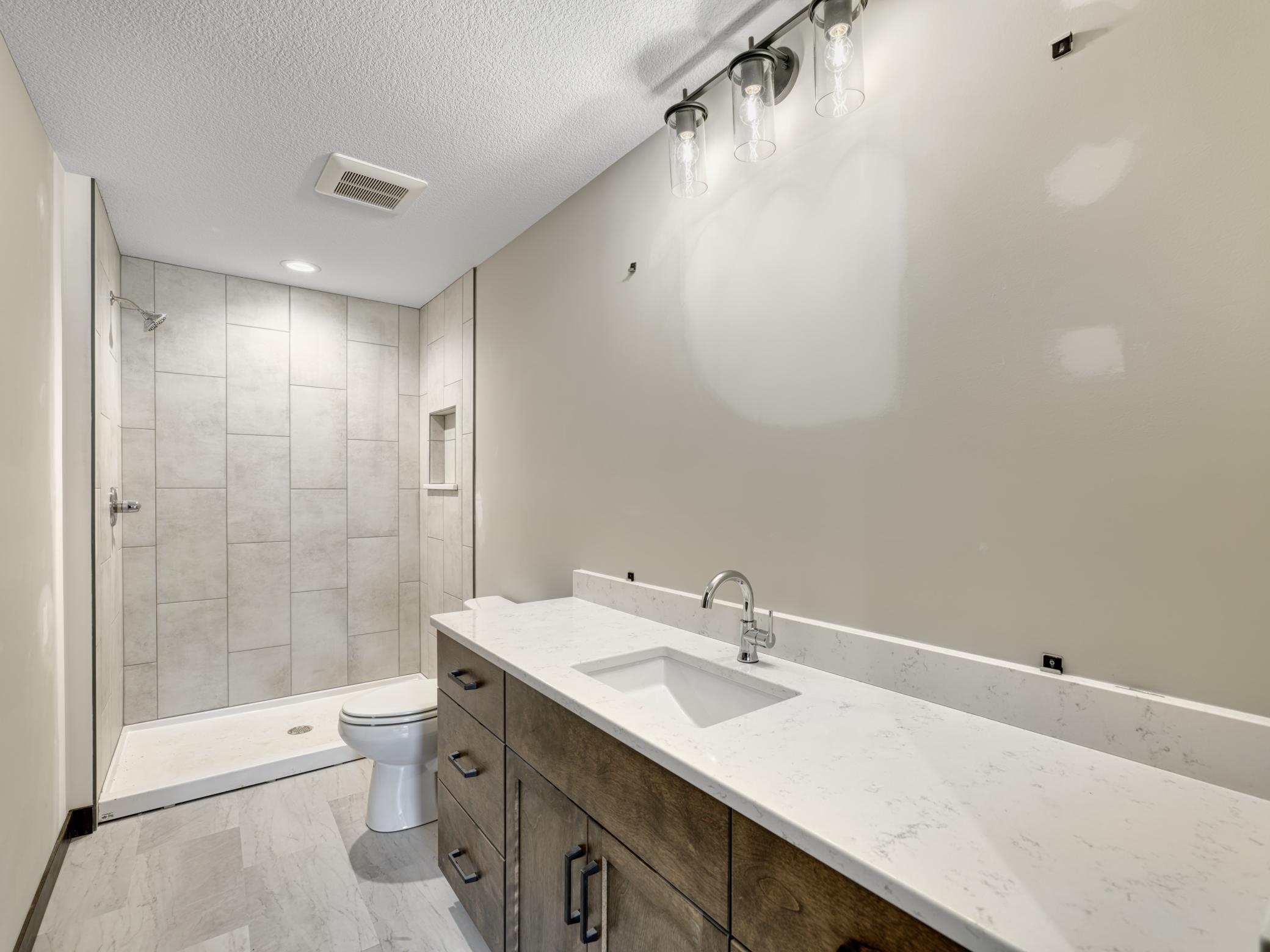 15 - 234 Primary Bath - Features custom tile, quartz counters and undermount sink