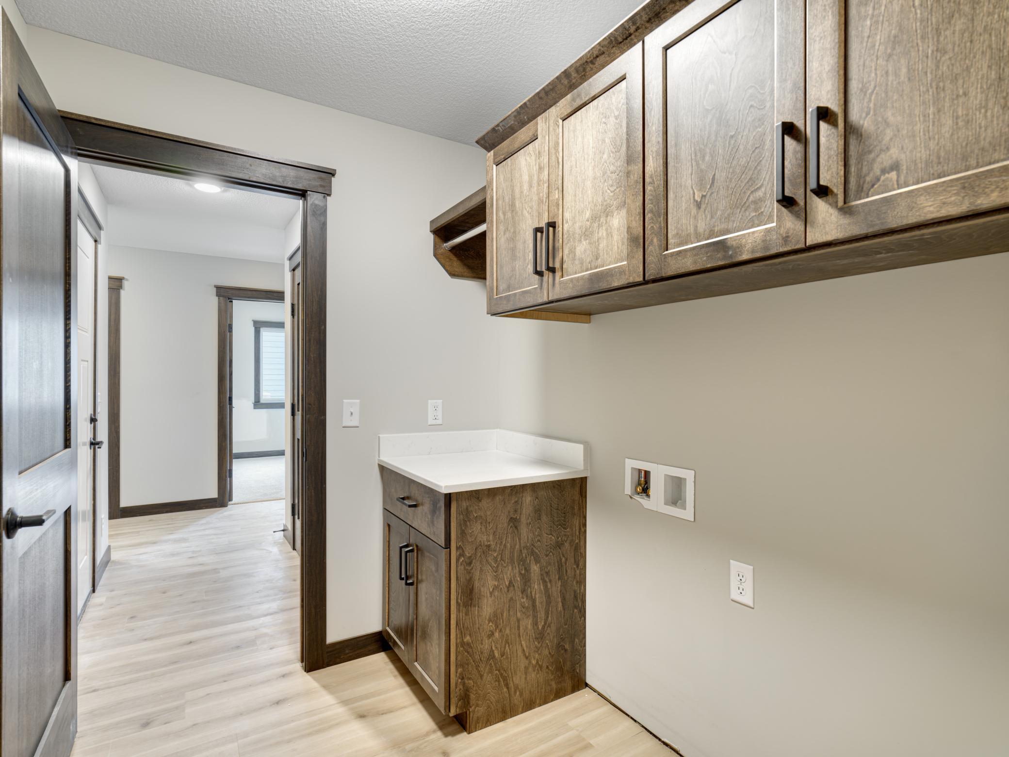 12 - 234 Laundry Room - Washer and dryer are included at this price. Notice the great built-in cabinetry and handy bar for hang-dry clothing
