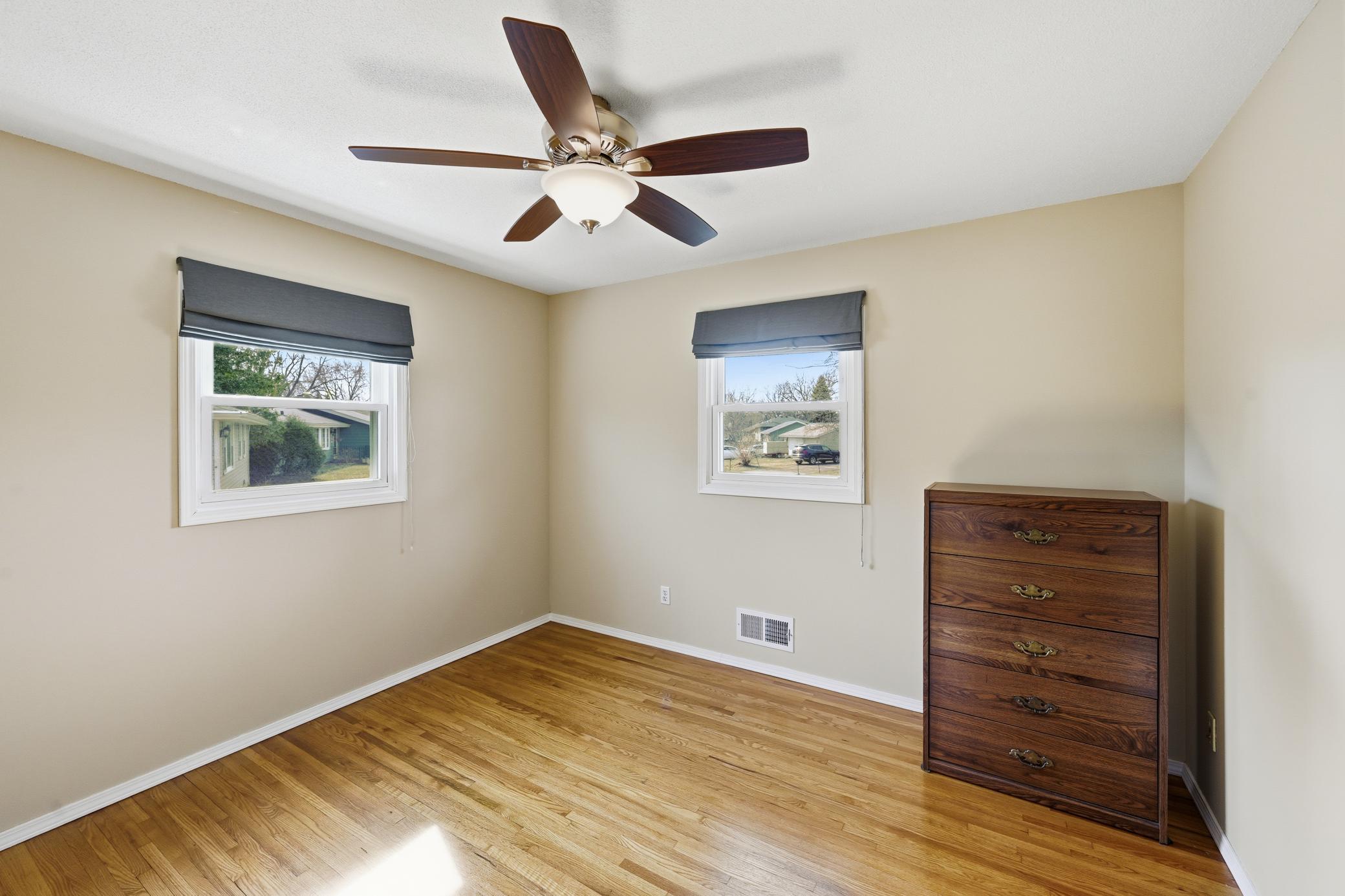 Second main level bedroom with 2 windows.